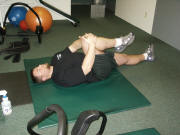 Leg Stretching: double and single leg pulls lying